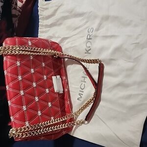 Authentic red Michael korks crossbody and shoulder bag
